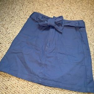 Short denim skirt by Francesca’s with a belt tie.